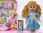Muñeca con pelo + tetero en caja